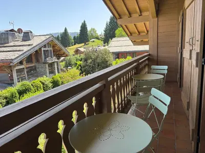 a balcony with two tables and chairs and a view at Le Mont - Vue montagne - Parking - Wifi - Nature in Demi-Quartier