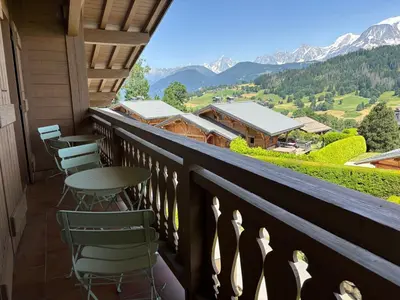 a balcony with chairs and a table and mountains at Le Mont - Vue montagne - Parking - Wifi - Nature in Demi-Quartier