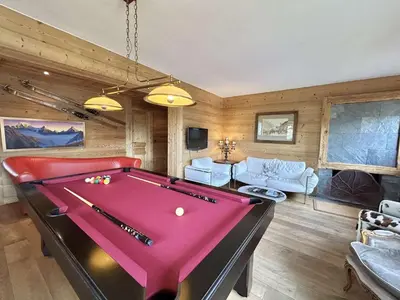 a living room with a pool table in it at Appartement 4 pièces, 6 couchages, balcon, parking, Megève - FR-1-597-194 in Megève