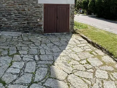 a door on a stone walkway with a building at Appartement 4 pièces, 6 couchages, balcon, parking, Megève - FR-1-597-194 in Megève