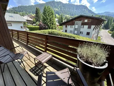 a balcony with chairs and a view of a mountain at Appartement 4 pièces, 6 couchages, balcon, parking, Megève - FR-1-597-194 in Megève