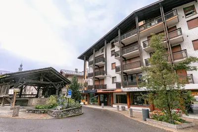 an apartment building in the middle of a street at Arly in Megève