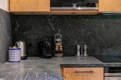 a kitchen with a counter top with a microwave at Escapade in Megève