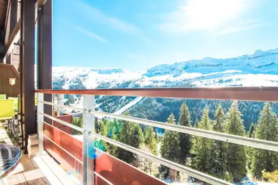 a balcony with a view of snow covered mountains at Residence Terrasses Eos, T2 48m2 Sud, Vue Montagne, avec Cheminee, Parking, Piscine in Flaine