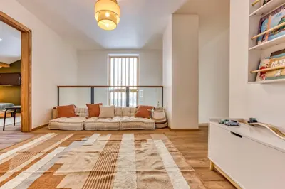 a living room with a couch and a table at AO HOUSE - Chalet PAN BENA in Les Houches