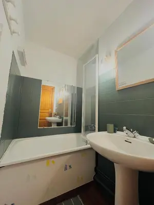 a bathroom with a sink and a mirror at Entre amis-Résidence La Piste Bleue-Ski aux pieds in Saint-Gervais-les-Bains