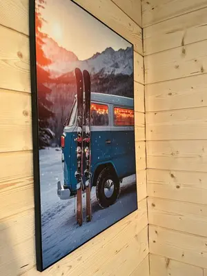 a picture of a van with skis hanging on a wall at Entre amis-Résidence La Piste Bleue-Ski aux pieds in Saint-Gervais-les-Bains