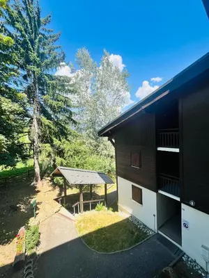 a view of a building with a gazebo at Entre amis-Résidence La Piste Bleue-Ski aux pieds in Saint-Gervais-les-Bains