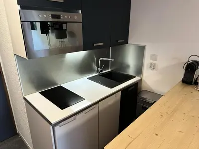 a kitchen with a sink and a microwave at Chalets Autrichiens - T2/4PAX - CHALETS AUTRICHIENS MAE-3263 in Megève