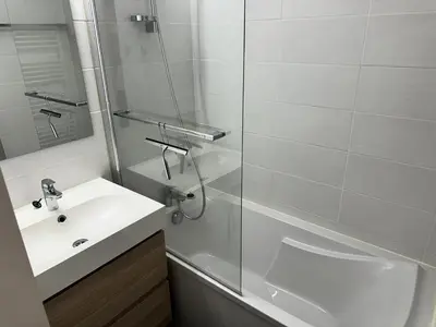 a white bathroom with a sink and a shower at Chalets Autrichiens - T2/4PAX - CHALETS AUTRICHIENS MAE-3263 in Megève