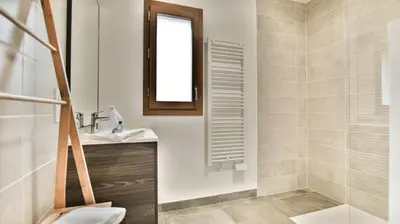 a bathroom with a sink and a shower at Le Sève - B103 in Samoëns