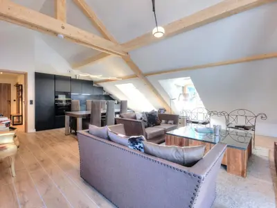 a dining room with a wooden table and chairs at Appartement 3 pièces, 4 pers, proche centre et télécabine, WiFi - FR-1-663-51 in Saint-Gervais-les-Bains