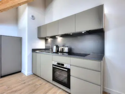 a bedroom with a large bed with wooden walls at 3 pièces avec balcon, proche centre et télécabine, animaux admis - FR-1-663-50 in Saint-Gervais-les-Bains