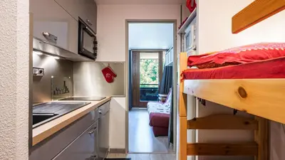 a small room with a bunk bed and a kitchen at Grand Horizon 1 N204 - 2P4 in Morillon