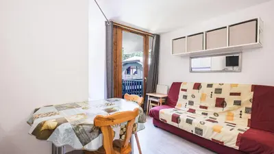 a room with a bed and a table and a couch at Grand Horizon 1 N204 - 2P4 in Morillon