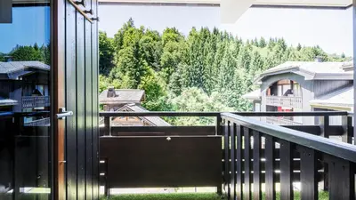 an open door to a balcony with a view of trees at Grand Horizon 1 N204 - 2P4 in Morillon
