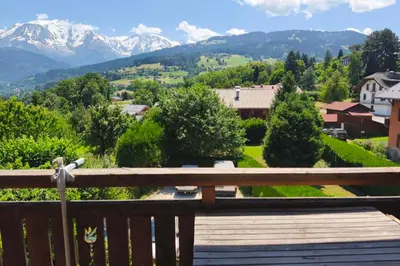 a view of the mountains from the balcony of a house at Accommodation of 167 m2 with views of Mont Blanc in Combloux