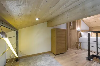 a bedroom with a bed and a wooden ceiling at Blanc Neige in Chamonix-Mont-Blanc