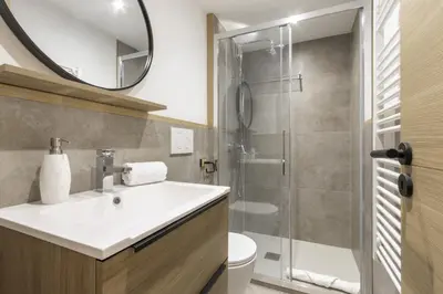 a bathroom with a sink and a shower at Blanc Neige in Chamonix-Mont-Blanc