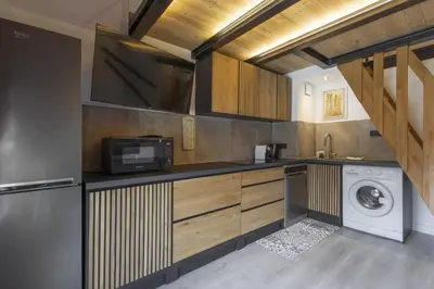 a kitchen with a washing machine and a washer at Blanc Neige in Chamonix-Mont-Blanc