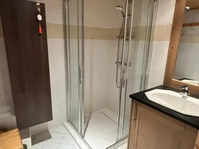 a bathroom with a shower and a sink at T4 Duplex à Samoëns, standing avec balcon & parking privé - FR-1-629-149 in Samoëns