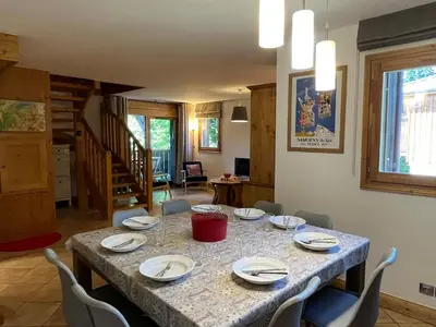 a dining room with a table and chairs at T4 Duplex à Samoëns, standing avec balcon & parking privé - FR-1-629-149 in Samoëns