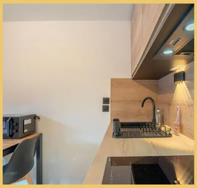a kitchen with a sink and a counter top at Studio La Piste Verte I Saint-Gervais in Saint-Gervais-les-Bains