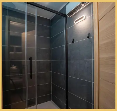 a bathroom with a shower with a glass door at Studio La Piste Verte I Saint-Gervais in Saint-Gervais-les-Bains
