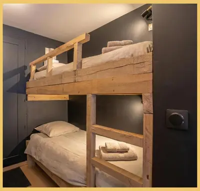 a couple of bunk beds in a room at Studio La Piste Verte I Saint-Gervais in Saint-Gervais-les-Bains