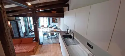 a kitchen with a sink and a counter top at South-facing flat with garden near city center in Saint-Gervais-les-Bains