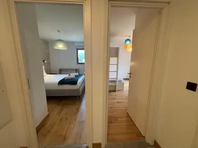 a view of a bedroom with a bed and a mirror at Kayla du Mont-Blanc - Espace bien etre - Piscine in Les Houches