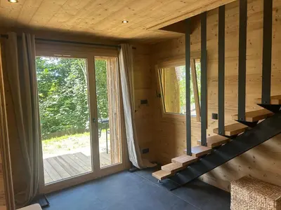 a room with a staircase in a wooden house at 35 m2 duplex in a new 2025 chalet in Saint-Gervais-les-Bains