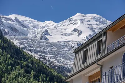 a view of a snow covered mountain from a building at Paradisa Cosmique Moderne 2-bedroom with amazing Mont-Blanc view! in Chamonix-Mont-Blanc