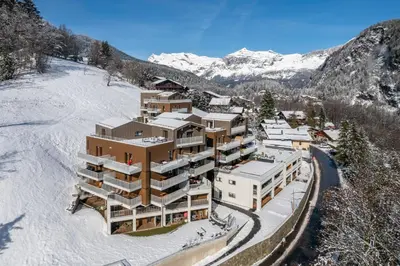 an aerial view of a hotel in the snow at Apartment Alpinea, Les Houches - by EMERALD STAY in Les Houches