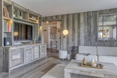 a living room with a couch and a table at Paradiso in Megève