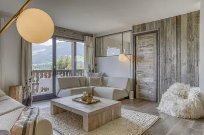 a living room with a couch and a table at Paradiso in Megève