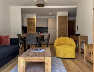 a living room with a couch and a table at Le Yeti (4 Pers) in Chamonix-Mont-Blanc