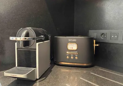 a toaster oven sitting on top of a counter at Le Yeti (4 Pers) in Chamonix-Mont-Blanc