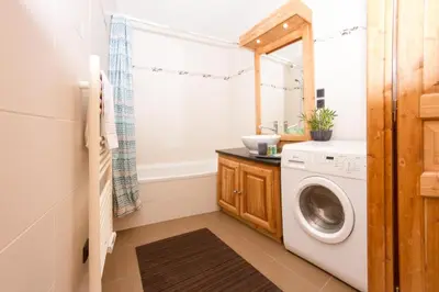 a laundry room with a washer and dryer at Le Paradis 24 apartment - Chamonix All Year in Chamonix-Mont-Blanc