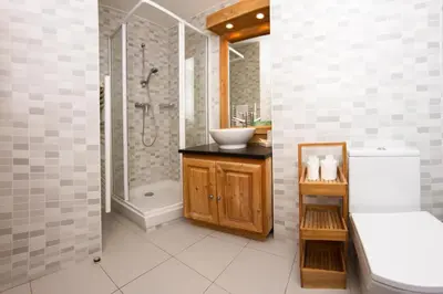 a bathroom with a shower and a sink and a toilet at Le Paradis 24 apartment - Chamonix All Year in Chamonix-Mont-Blanc