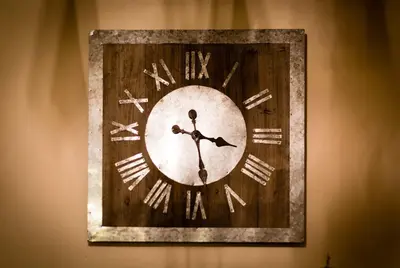 a clock is hanging on a wall at Le Paradis 8 apartment - Chamonix All Year in Chamonix-Mont-Blanc
