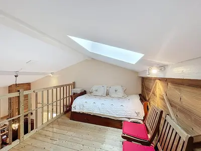 a bedroom with a bed and a skylight at Appartement 2 chambres, mezzanine, vue Mont Blanc, proche village, parking - FR-1-560-164 in Combloux