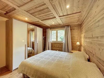 a bedroom with a bed and a wooden ceiling at Appartement 2 chambres, mezzanine, vue Mont Blanc, proche village, parking - FR-1-560-164 in Combloux