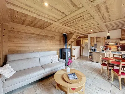 a living room with a couch and a table at Appartement 2 chambres, mezzanine, vue Mont Blanc, proche village, parking - FR-1-560-164 in Combloux