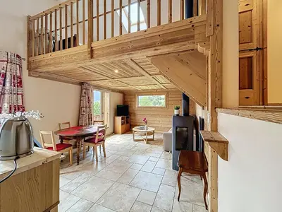 a kitchen and living room with a wooden ceiling at Appartement 2 chambres, mezzanine, vue Mont Blanc, proche village, parking - FR-1-560-164 in Combloux