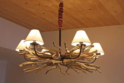 a chandelier is hanging from a ceiling at Le Paradis 18 - Chamonix All Year in Chamonix-Mont-Blanc