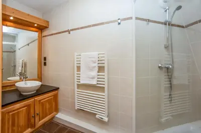 a bathroom with a shower and a sink at Le Paradis 18 - Chamonix All Year in Chamonix-Mont-Blanc