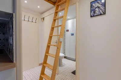 a wooden ladder in a bathroom with a toilet at Studio avec vue sur les montagnes in Les Contamines-Montjoie
