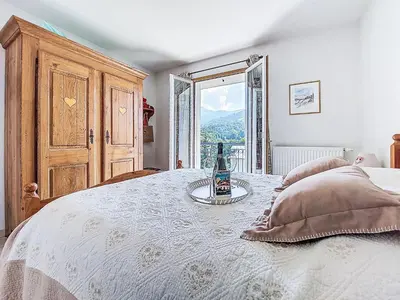 a bedroom with a white bed with a window at Apartment Domaine de Crespin-6 by Interhome in Saint-Gervais-les-Bains
