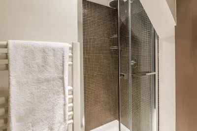 a shower with a glass door in a bathroom at Apartment Vila 2 - Charming 2 Bedroom Haven in Chamonix in Chamonix-Mont-Blanc